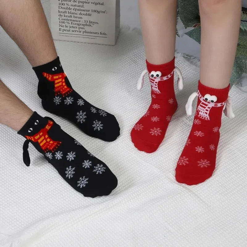 Hand Holding Christmas Socks