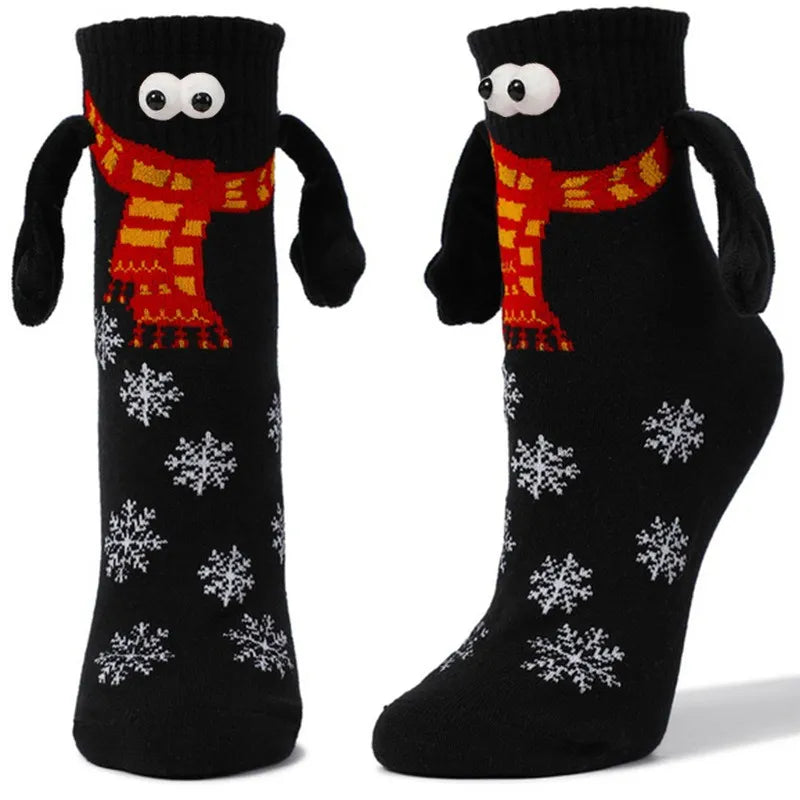 Hand Holding Christmas Socks