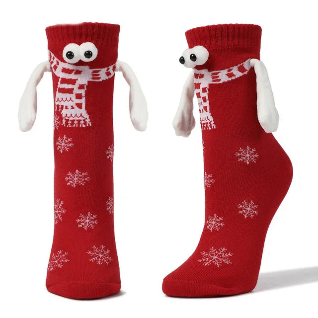 Hand Holding Christmas Socks