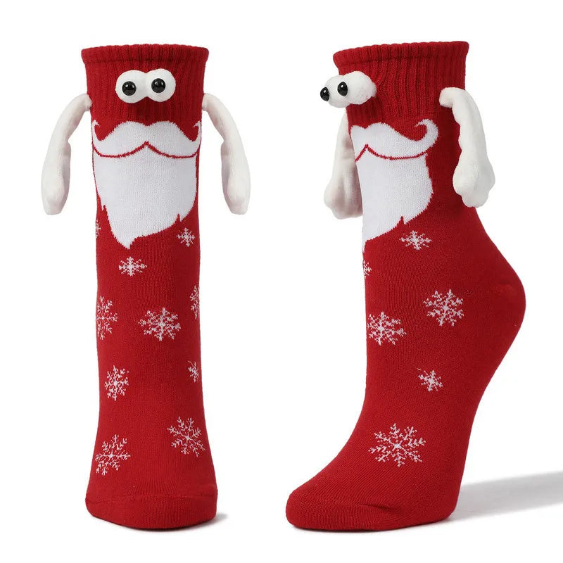 Hand Holding Christmas Socks